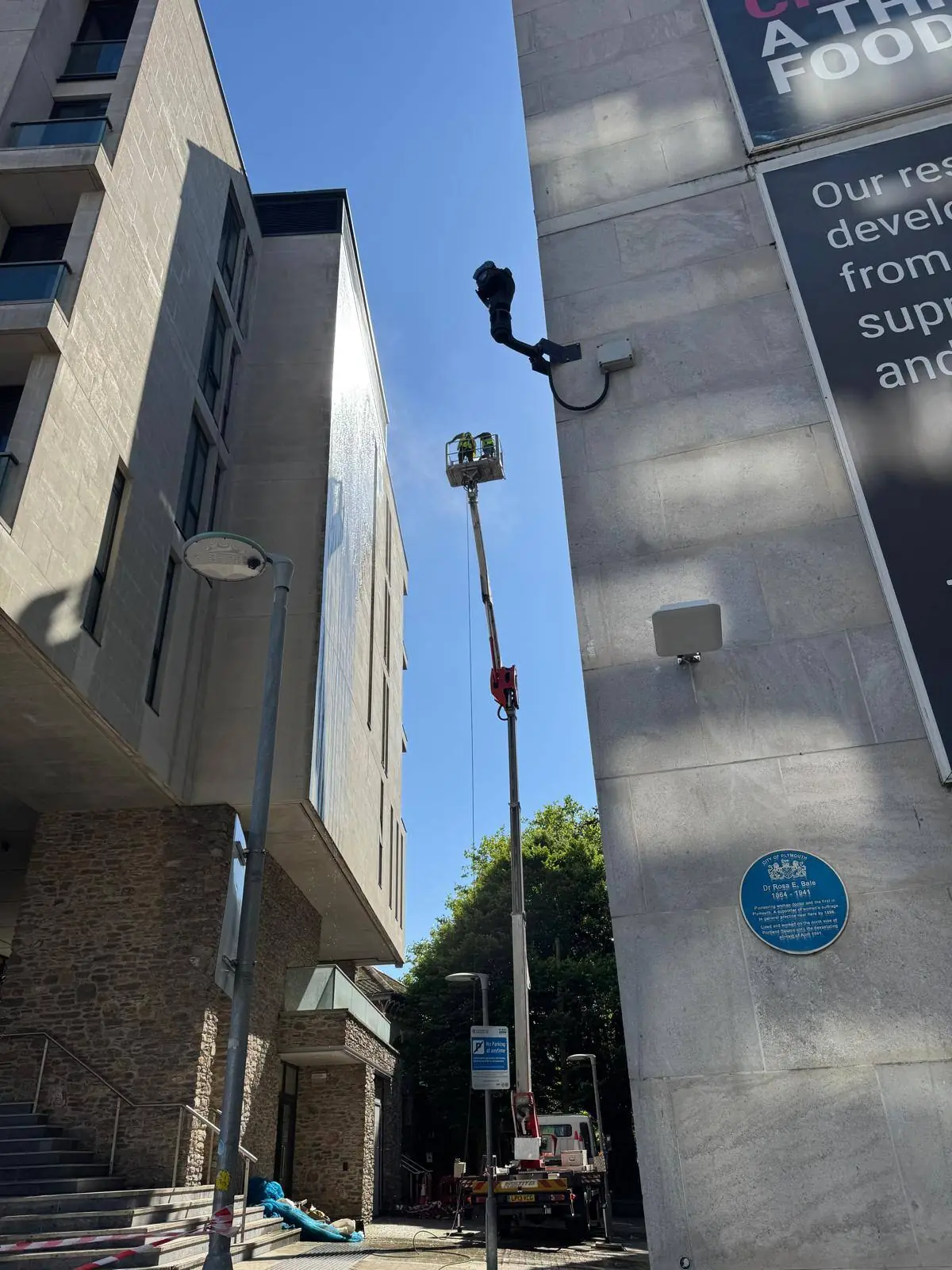 Cherry picker close-up during high-level cleaning work