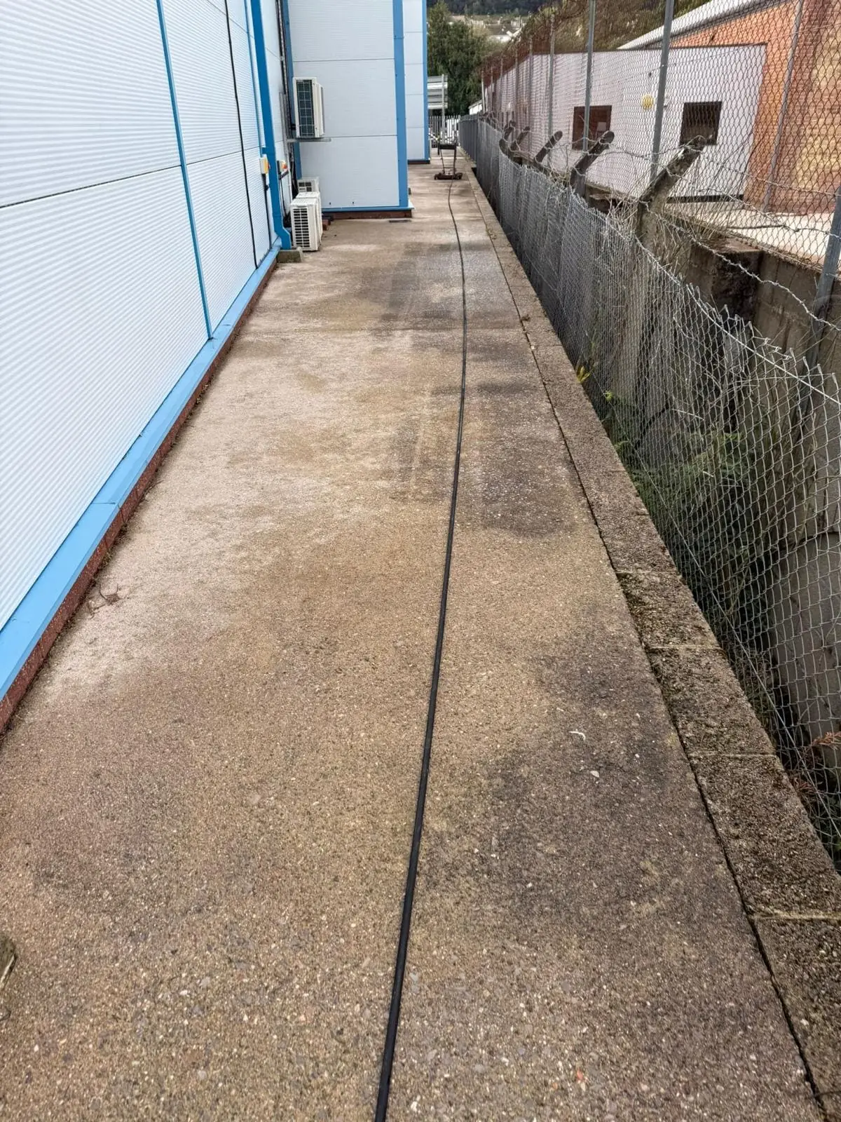 Commercial pathway restored with professional pressure washing