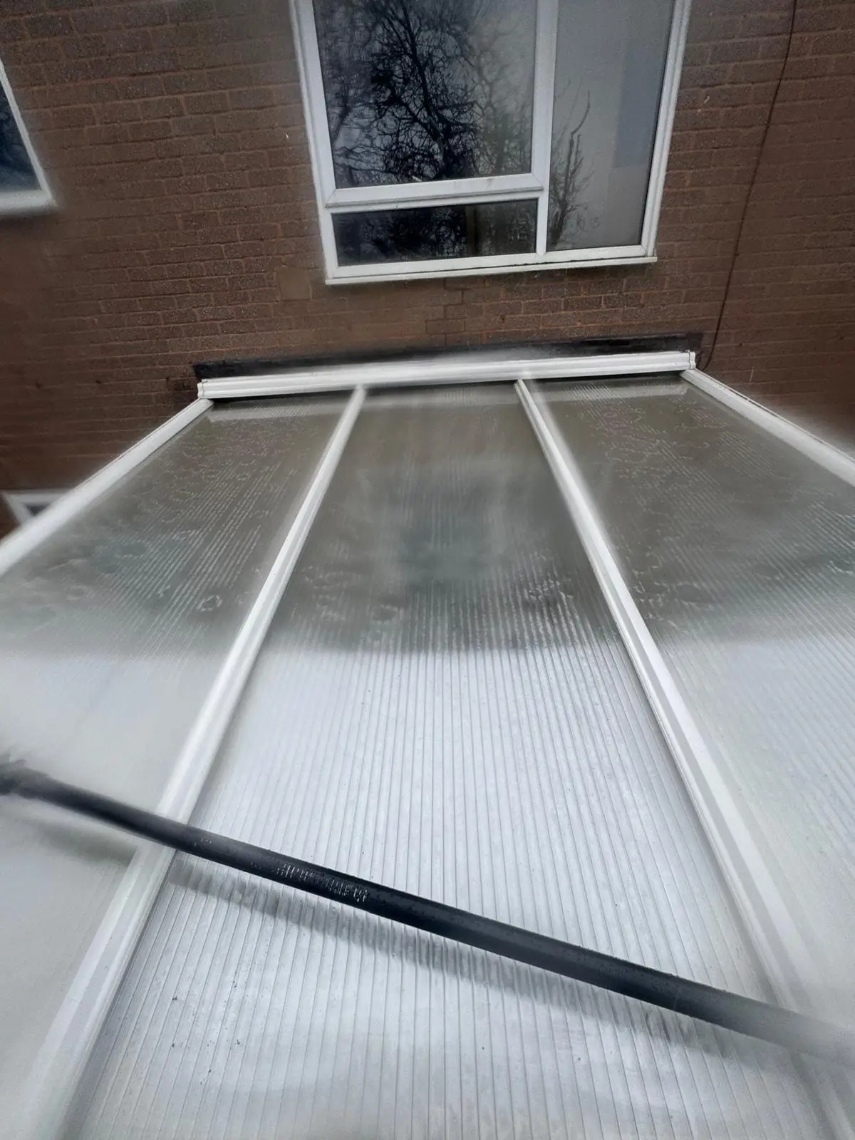 Conservatory roof cleaned with low-pressure rinse technique