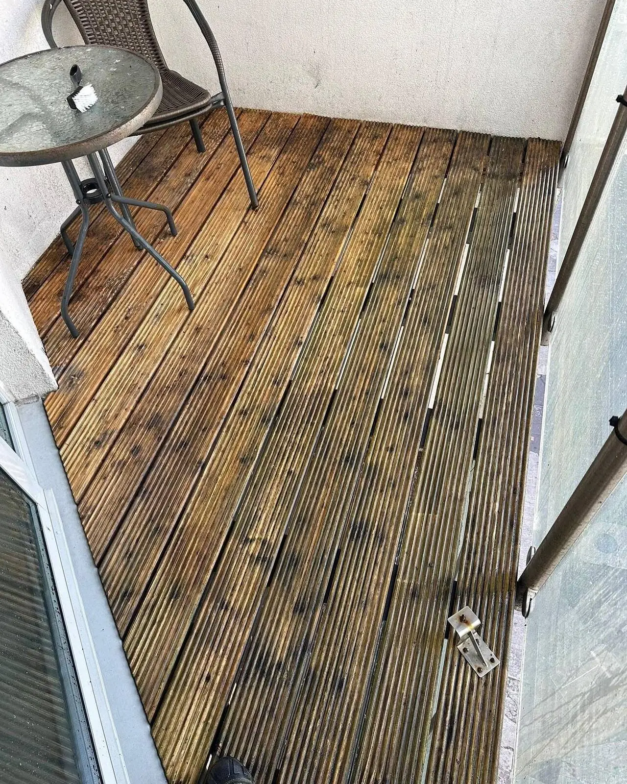 Wooden decking cleaned and restored revealing original timber colour