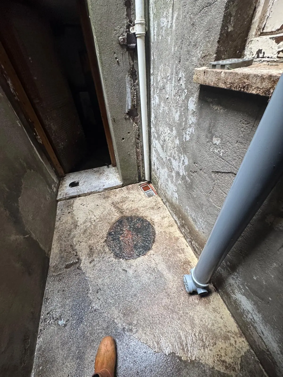 Drain area pressure washed and cleared of debris